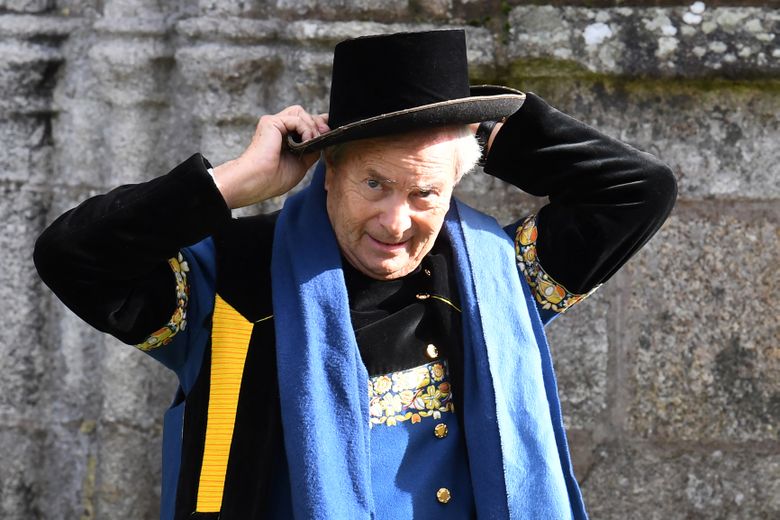 Vincent Bolloré adjusts his hat as he wears traditional outfits during a ceremony marking his band's 200th anniversary at the Kerdevot Chapel in Ergue-Gaberic, Brittany.